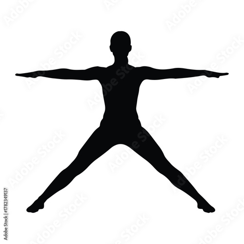 Silhouette of a person in a wide-legged yoga pose exercise