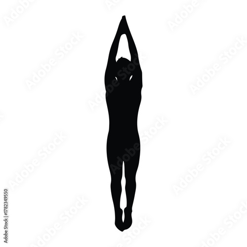 Silhouette of a person in a yoga pose with arms raised
