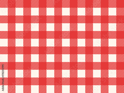 Red and white checkered tablecloth pattern background in classic style. Vichy gingham texture with bright christmas tones bg. Elegant festive plaid design.