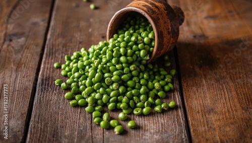 Green peas arranged in a bo...
