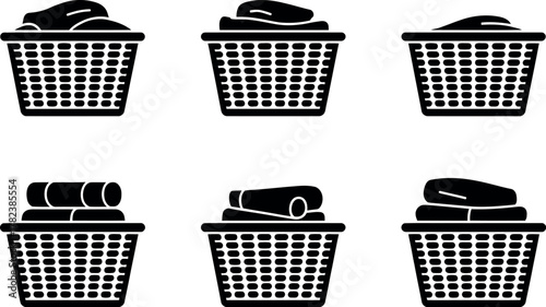 Collection of laundry baskets filled with clothes ready for washing or freshly folded and ready to be put away