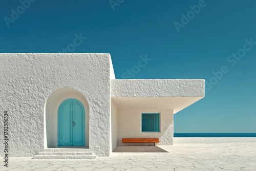 Fototapeta Naklejka Na Ścianę i Meble -  A clean architectural shot of a white stucco and glass structure