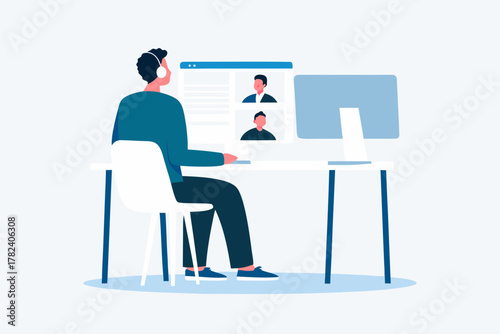 Man wearing headphones participates in a video conference call with colleagues on his computer