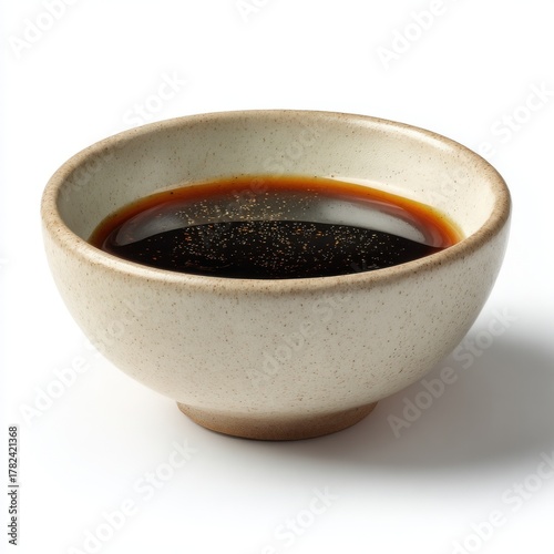 Soy Sauce in a Ceramic Bowl on White Background, Condiment, Dipping sauce, Stoneware