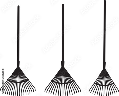 Three black garden leaf rakes in a row silhouette isolated on transparent background
