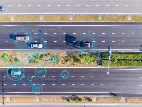 Top view of modern highway with autonomous cars using digital data connections and smart technology for intelligent transportation and traffic management.