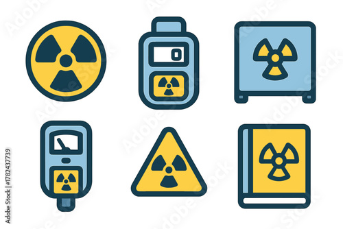 Variety of nuclear hazard symbols and monitoring equipment displayed on a flat surface, emphasizing safety measures and awareness