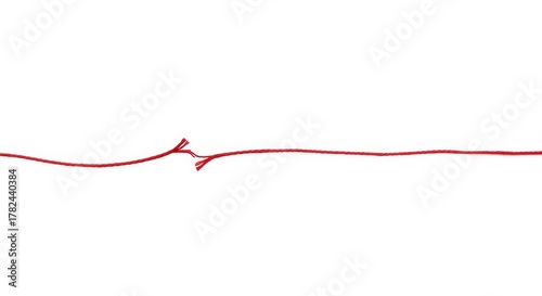 A single red string is broken on a clean white background telling a symbolic story of separation