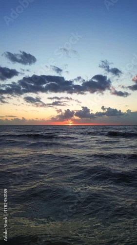 Golden sunlight over rolling waves, Calm sea with expansive blue sky, Dramatic sky with gentle ocean and peaceful mood