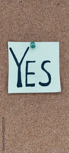 YES note pinned to cork board – productivity and goal achievement symbol