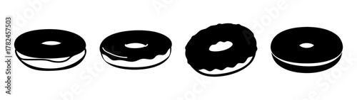 Four black donuts with chocolate glaze and white filling