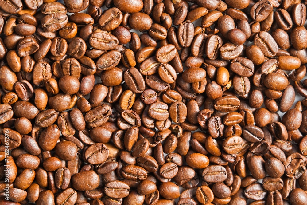 Fototapeta premium Top view of aromatic roasted coffee beans.