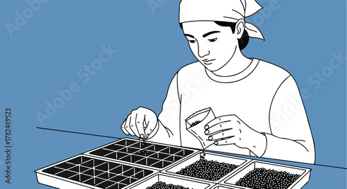 Person planting seeds in a tray