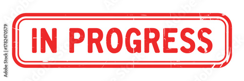 Red and white in progress stamp with rounded corners