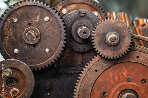 Rusty gear mechanism. Rusty texture, mechanical parts, gears, spare parts, old rusty iron wheels.