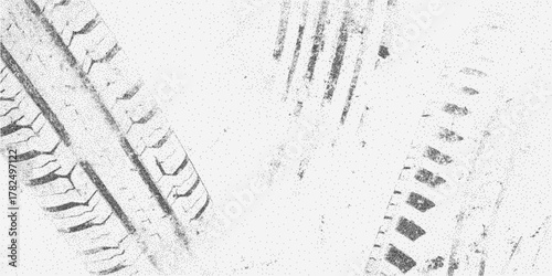 Grunge background with tire tracks, rough grain texture, speckles and distressed stains for a rugged industrial worn effect.