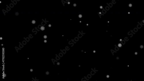 white snow flake falling on black background 