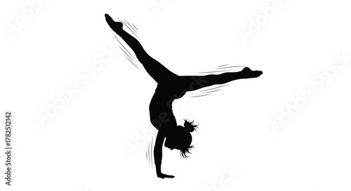 Silhouette of a female gymnast performing a handstand, demonstrating balance and flexibility