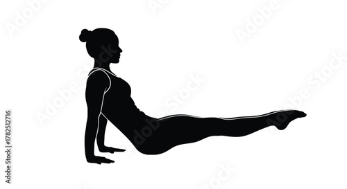 Silhouette of a woman doing the boat pose, a yoga asana, the pose strengthens the core muscles