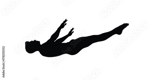 Silhouette of a gymnast performing a back layout graceful athlete in midair, showcasing strength and flexibility