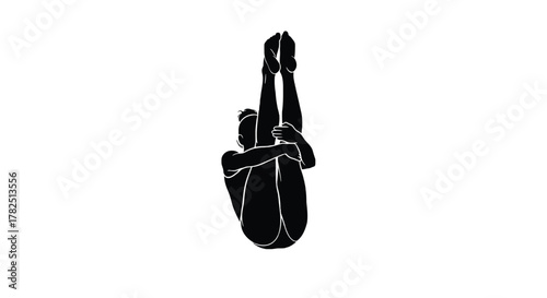 Silhouette of a woman doing yoga pose, lying on her back with legs raised and arms around knees