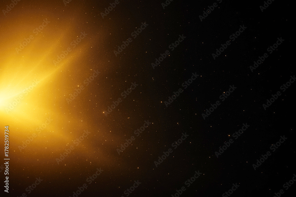 Obraz premium Bright Golden Sunburst with Tiny Stars on Black Background abstract light