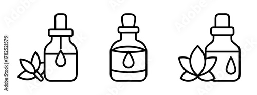 Essential oil bottles with dropper and leaves aromatherapy wellness spa skincare beauty product