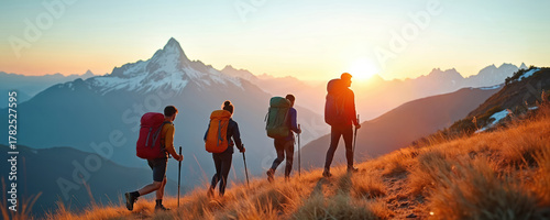 Friends hike in mountains with backpacks, poles at sunrise. Group of people trekking up hill on summer adventure. Young tourists enjoy active journey together towards snowy peak, enjoying scenic