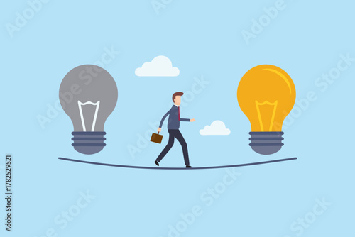 Businessman walking a tightrope between a gray unlit lightbulb and a bright yellow lit lightbulb representing ideas