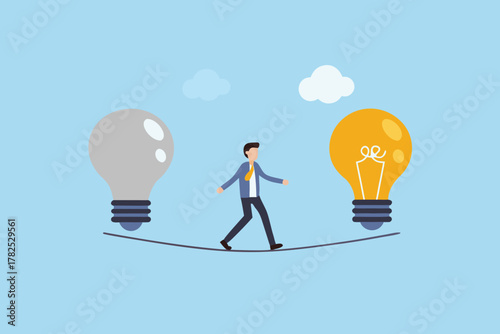 Businessman walking a tightrope between a grey and a glowing yellow light bulb representing ideas