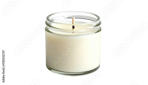 A small, cylindrical candle in a clear glass jar, with the wick centered and unlit