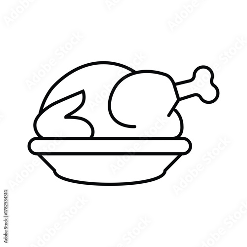 A roasted chicken sits in a serving dish The chicken has defined outline and is ready to eat