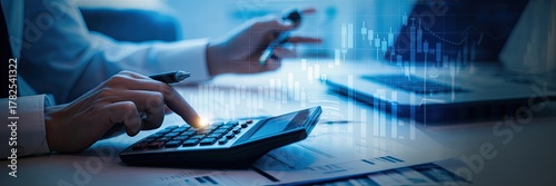 Professional accountant calculating financial data with charts and graphs in modern office