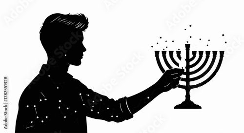 Silhouette of a person lighting a menorah with a sense of wonder