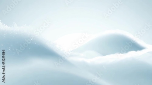 Smooth waves of white fabric move softly under bright clean light creating minimal aesthetic texture and calm abstract motion