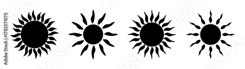 Four stylized black sun icons with rays radiating outward on a