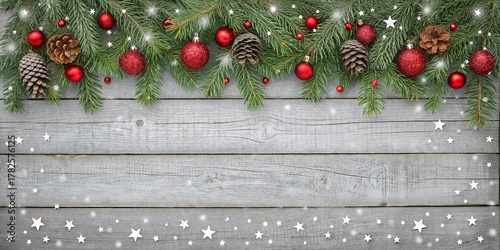 Festive Winter Garland with Red Ornaments and Pine Cones on Snowy Wood Copy Space Background.
