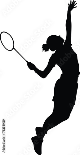 Silhouette of a dynamic female badminton player leaping to smash the shuttlecock during a competitive match