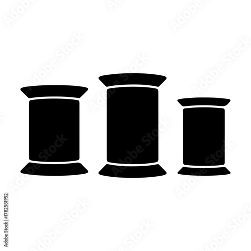 Three black thread spools in a row design