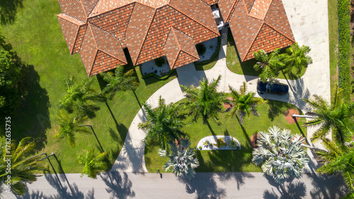 aerial overhead view of luxury estate driveway and beautiful tropical landscape 