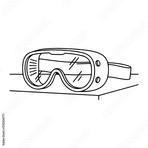 Protective ski goggles ready for adventure on a clean surface