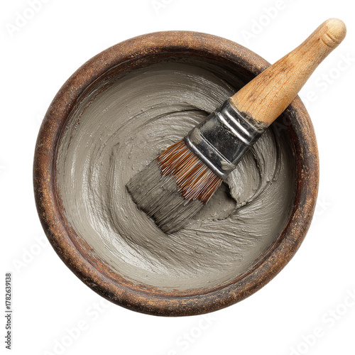 Mixing Gray Paint in a Wooden Bowl With a Brush on a Clean Surface