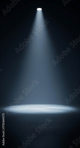 Dramatic bright spotlight on empty stage dark concrete wallpaper