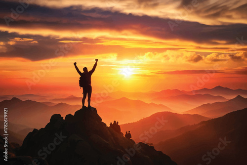 Summit of Success Silhouette on Mountain Peak Against Fiery Sunset