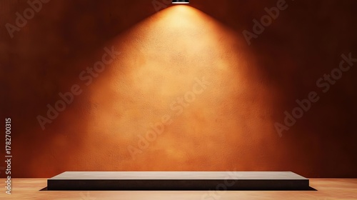 Empty display podium under spotlights against textured orange wall