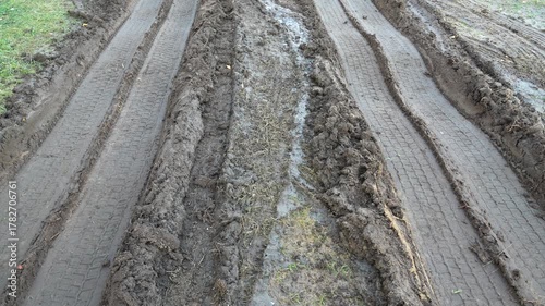 dirty dirt road. A rural road after the rains. Tracks from the wheels of heavy machinery.