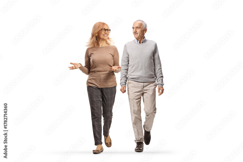 Fototapeta premium Mature man and woman walking together and talking