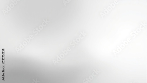 A blurry gray background with a few white circles. The background is mostly gray with some white