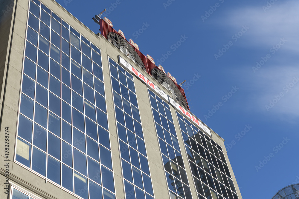 Obraz premium Sam the Record Man sign installed atop 277 Victoria St, facing Sankofa Square, Toronto