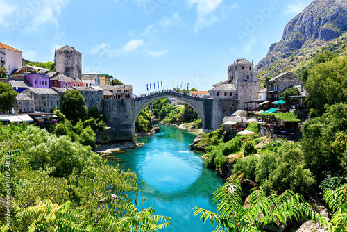 Photos Beautiful view of the Old Bridge in Mostar, Bosnia and Herzegovina, spanning the turquoise Neretva River on a sunny summer day